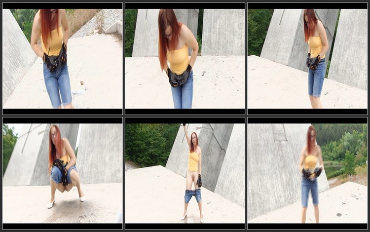 Redhead girl peed on the street
